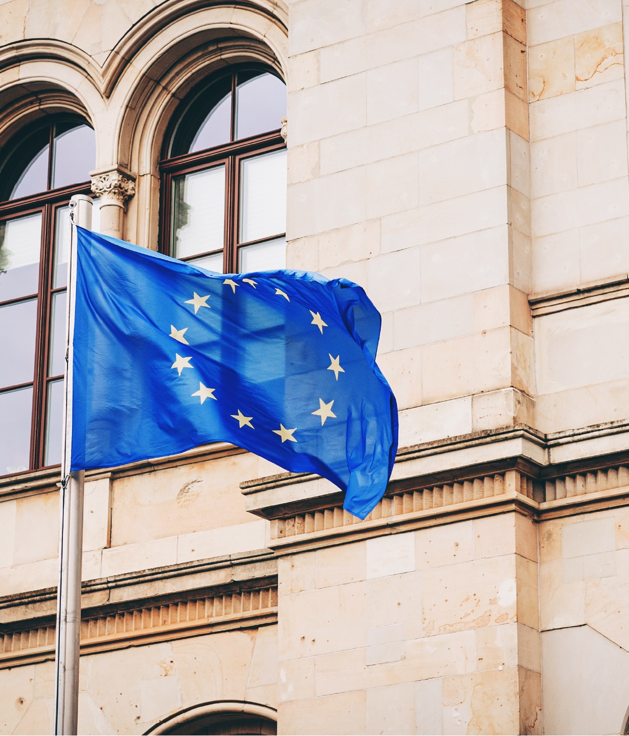 EU flag flying in front of a government building